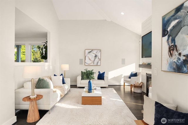 6006 SE 30th St, Mercer Island, WA 98040 - living area with vaulted ceiling, dark wood finished floors, a glass covered fireplace, and baseboards