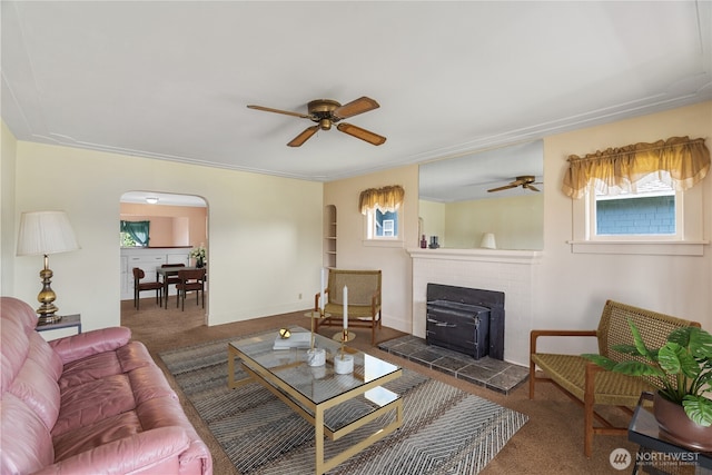 504 W 4th St, Aberdeen, WA 98520 - living area featuring ceiling fan, carpet flooring, and arched walkways