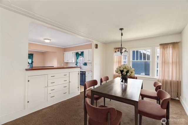 504 W 4th St, Aberdeen, WA 98520 - dining area featuring dark carpet, a chandelier, and crown molding