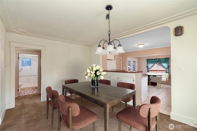 504 W 4th St, Aberdeen, WA 98520 - dining space with light colored carpet, baseboards, and light tile patterned floors