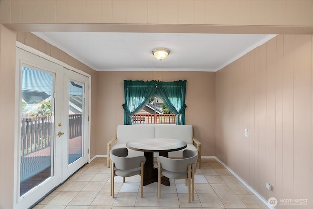 504 W 4th St, Aberdeen, WA 98520 - dining space with french doors, light tile patterned flooring, ornamental molding, and baseboards