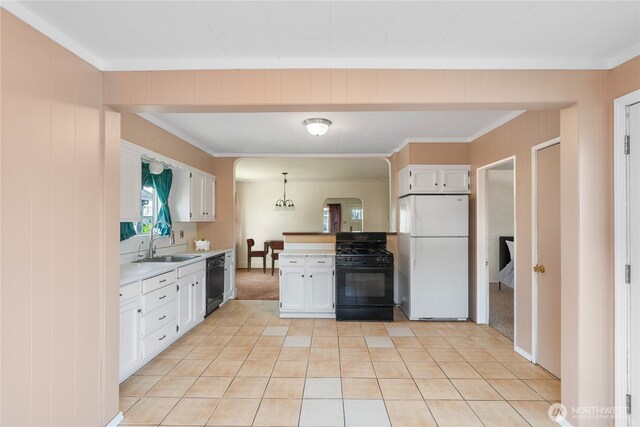 504 W 4th St, Aberdeen, WA 98520 - kitchen with black appliances, a sink, light countertops, white cabinets, and ornamental molding