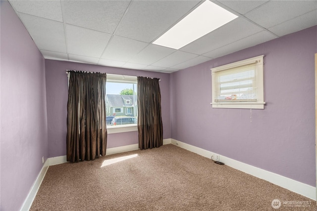504 W 4th St, Aberdeen, WA 98520 - carpeted empty room featuring a paneled ceiling and baseboards