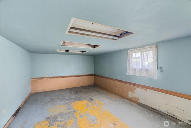 504 W 4th St, Aberdeen, WA 98520 - spare room featuring attic access and concrete flooring
