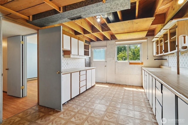32427 6th Ave, Black Diamond, WA 98010 - kitchen featuring white cabinets, open shelves, light floors, and light countertops