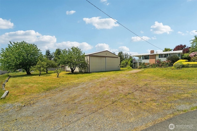 32427 6th Ave, Black Diamond, WA 98010 - view of green lawn featuring a pole building, an outdoor structure, and a garage