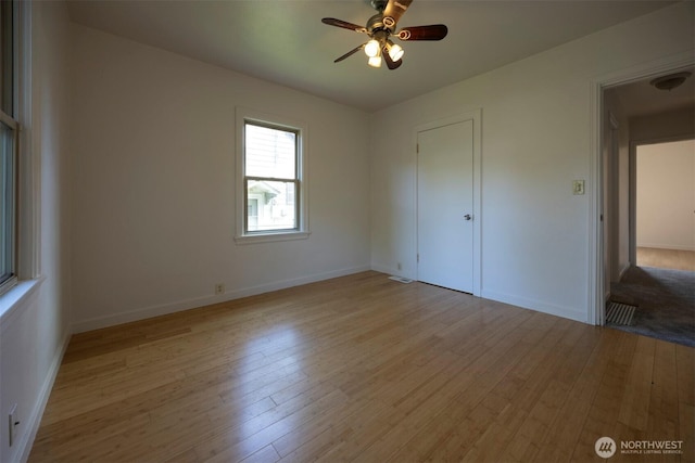 1030 N Clinton St, Walla Walla, WA 99362 - unfurnished bedroom with wood finished floors, baseboards, and a ceiling fan