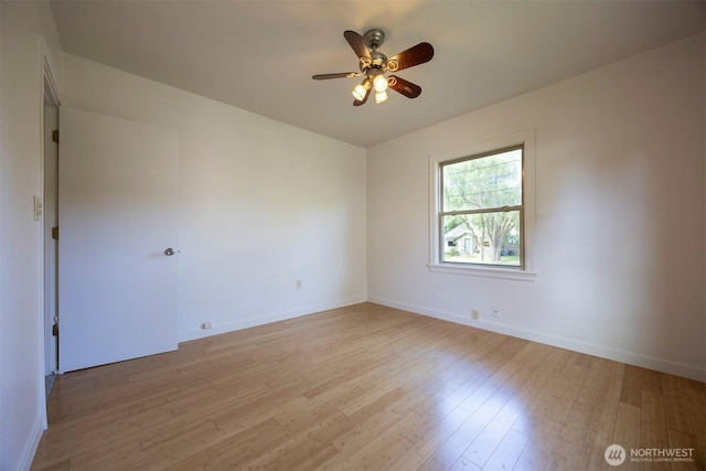 1030 N Clinton St, Walla Walla, WA 99362 - empty room with light wood-style flooring, a ceiling fan, and baseboards
