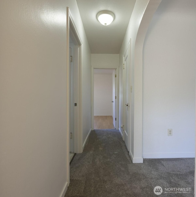 1030 N Clinton St, Walla Walla, WA 99362 - corridor with carpet, baseboards, and arched walkways