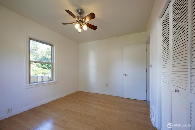 1030 N Clinton St, Walla Walla, WA 99362 - unfurnished bedroom featuring light wood-style flooring, baseboards, a closet, and a ceiling fan
