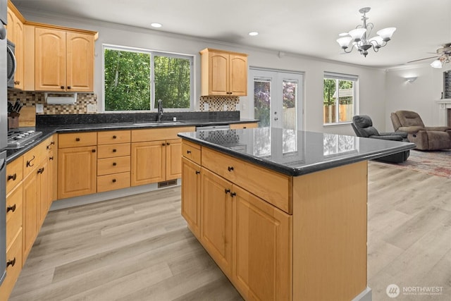 13901 Cedar Ct, Sultan, WA 98294 - kitchen with a sink, open floor plan, ornamental molding, light brown cabinetry, and a chandelier