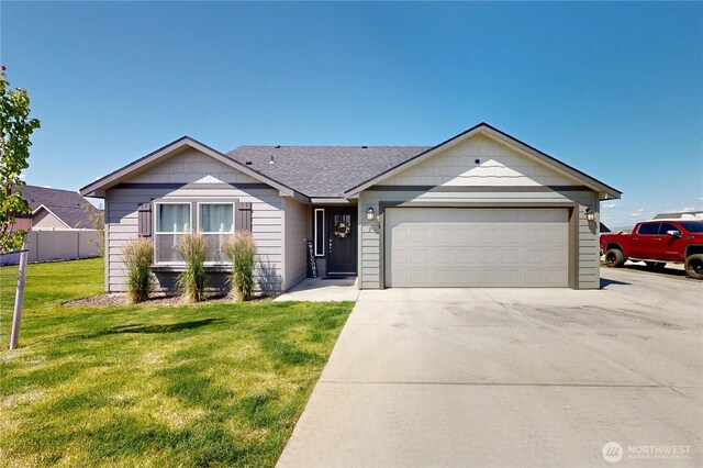 7 Patty Cir, Milton-Freewater, OR 97862 - single story home featuring a garage, driveway, and a front lawn