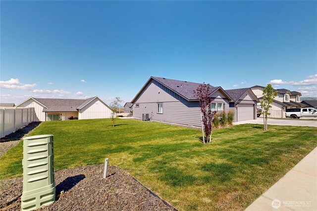 7 Patty Cir, Milton-Freewater, OR 97862 - view of property exterior featuring driveway, a garage, board and batten siding, and central air condition unit