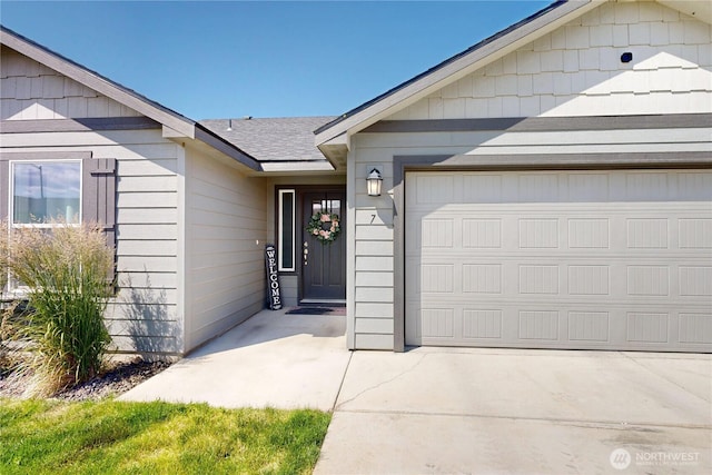 7 Patty Cir, Milton-Freewater, OR 97862 - entrance to property with a garage and a shingled roof