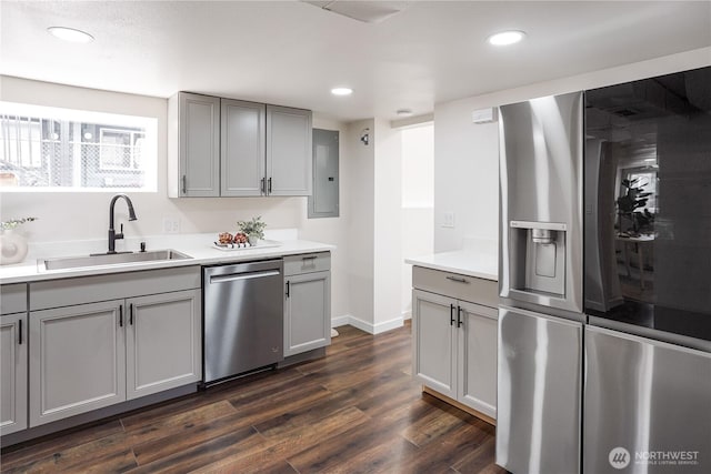 5909 8th Ave NW, Seattle, WA 98107 - kitchen with stainless steel appliances, a sink, gray cabinets, electric panel, and recessed lighting