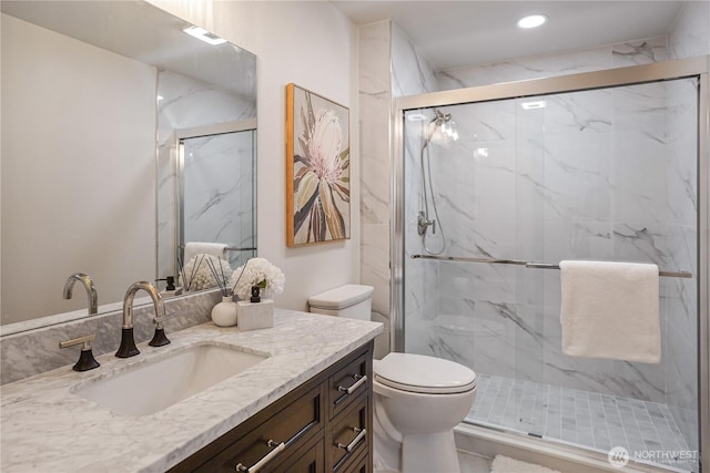 5909 8th Ave NW, Seattle, WA 98107 - full bathroom featuring toilet, vanity, a marble finish shower, and recessed lighting