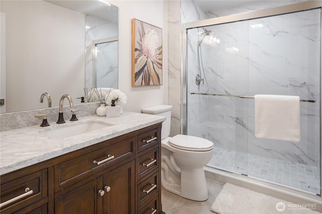 5909 8th Ave NW, Seattle, WA 98107 - bathroom with toilet, vanity, and a marble finish shower