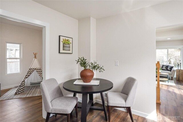 5909 8th Ave NW, Seattle, WA 98107 - dining space featuring dark wood-type flooring and baseboards