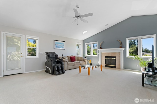1022 S 225th Ln, Des Moines, WA 98198 - carpeted living room with a tiled fireplace, lofted ceiling, and a ceiling fan