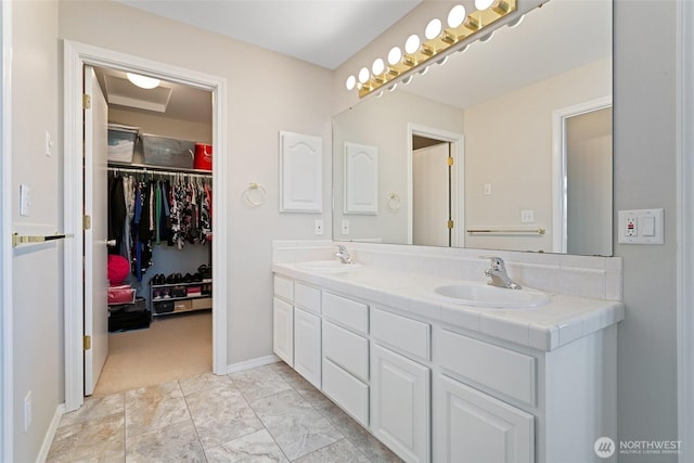 1022 S 225th Ln, Des Moines, WA 98198 - bathroom with double vanity and a walk in closet