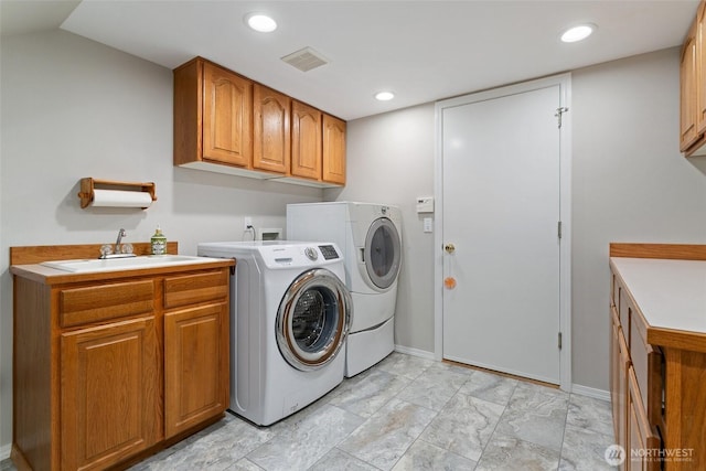 1022 S 225th Ln, Des Moines, WA 98198 - washroom with independent washer and dryer, cabinet space, recessed lighting, and light marble finish floors