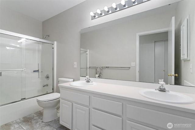 1022 S 225th Ln, Des Moines, WA 98198 - bathroom featuring double vanity and shower / bath combination with glass door