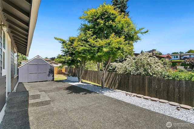 1022 S 225th Ln, Des Moines, WA 98198 - view of patio / terrace with a storage unit