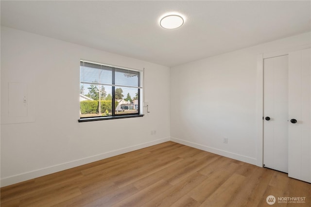 5201 S M St, Tacoma, WA 98408 - empty room with light wood finished floors and baseboards