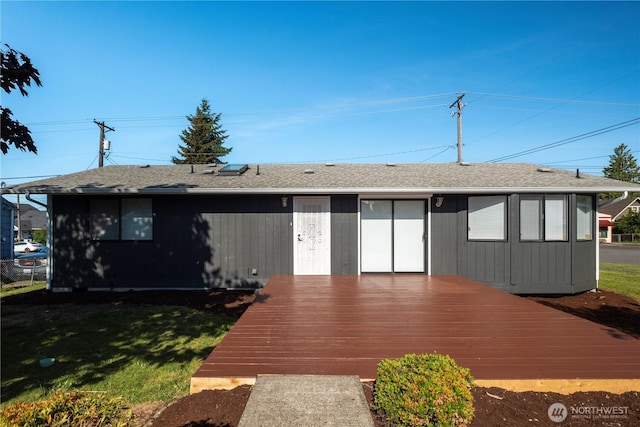 5201 S M St, Tacoma, WA 98408 - back of house featuring a deck and a lawn