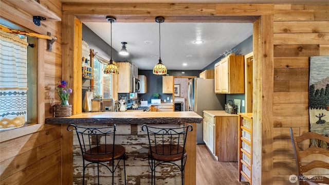 136 Tamarack Ln, Dayton, WA 99328 - kitchen with wood finished floors, stainless steel appliances, decorative light fixtures, a peninsula, and recessed lighting