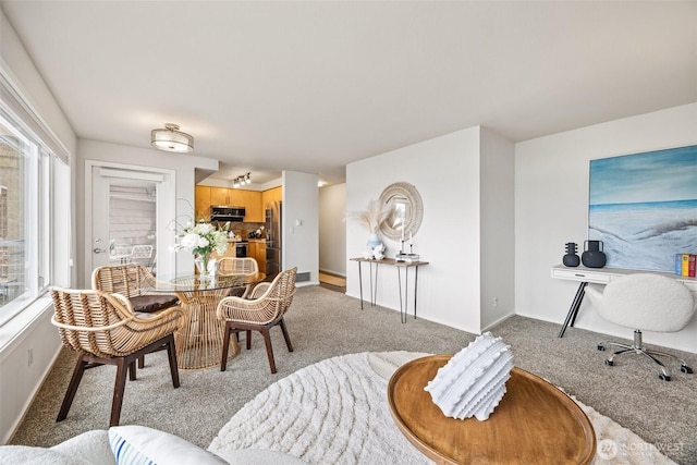 334 Lakeside Ave S Unit 404, Seattle, WA 98144 - dining room featuring light carpet and baseboards