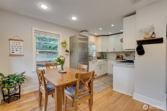 9741 Densmore Ave N, Seattle, WA 98103 - dining room with light wood-type flooring and recessed lighting