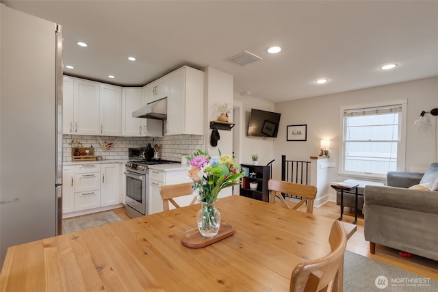 9741 Densmore Ave N, Seattle, WA 98103 - dining area featuring light wood-style flooring and recessed lighting