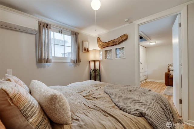 9741 Densmore Ave N, Seattle, WA 98103 - bedroom featuring wood finished floors and a wall unit AC