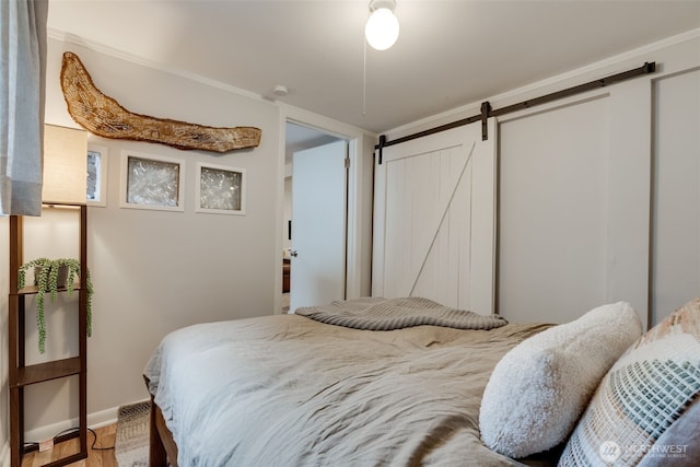 9741 Densmore Ave N, Seattle, WA 98103 - bedroom featuring a barn door and baseboards
