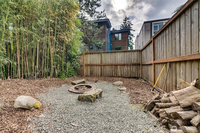 9741 Densmore Ave N, Seattle, WA 98103 - view of yard featuring an outdoor fire pit