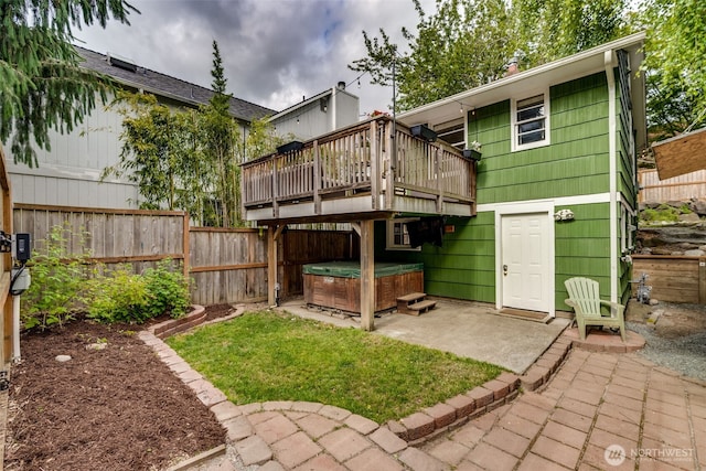 9741 Densmore Ave N, Seattle, WA 98103 - back of house with a hot tub, a patio area, a fenced backyard, and a deck