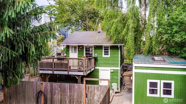 9741 Densmore Ave N, Seattle, WA 98103 - back of house featuring a wooden deck and a shingled roof