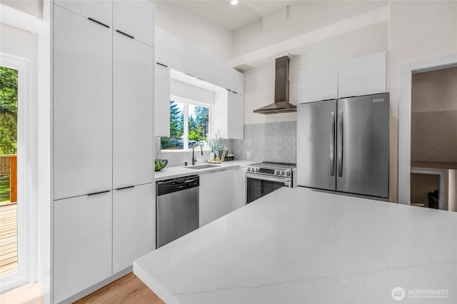1279 Stilson Ave SE, North Bend, WA 98045 - kitchen featuring wall chimney range hood, appliances with stainless steel finishes, modern cabinets, and recessed lighting