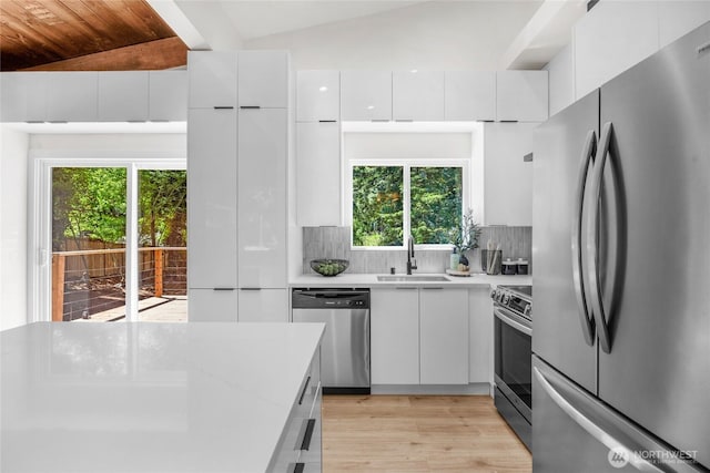 1279 Stilson Ave SE, North Bend, WA 98045 - kitchen with stainless steel appliances, a sink, plenty of natural light, light countertops, and wood ceiling