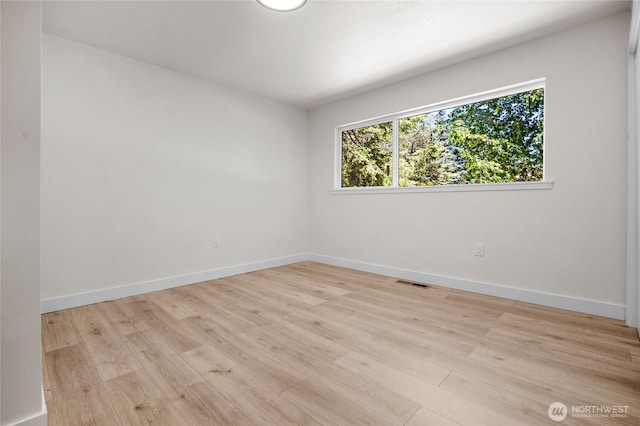 1279 Stilson Ave SE, North Bend, WA 98045 - unfurnished room featuring healthy amount of natural light, light wood-type flooring, and baseboards