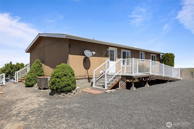 7220 E Belmont St, Othello, WA 99344 - view of front of property with a wooden deck, central air condition unit, and stairs