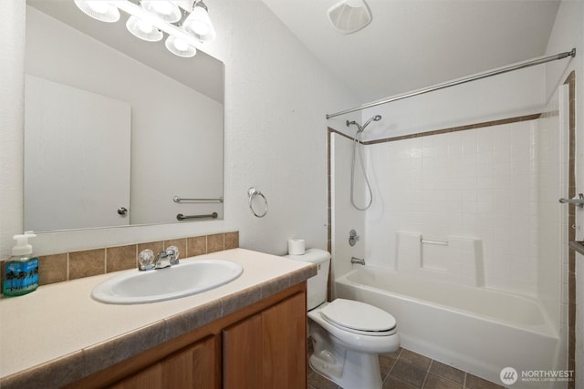7220 E Belmont St, Othello, WA 99344 - bathroom with toilet, vanity, tub / shower combination, and tile patterned floors