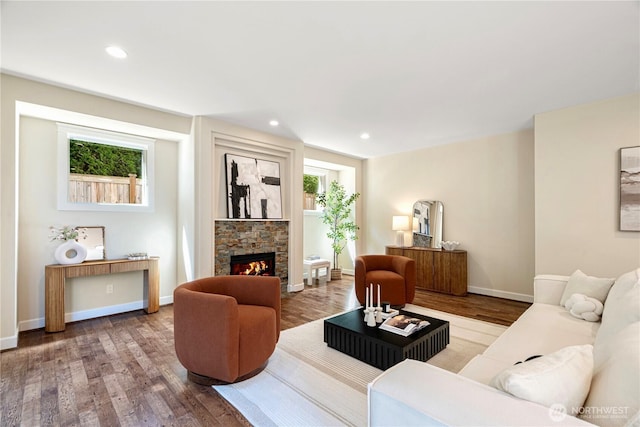 8910 125th Ln NE, Kirkland, WA 98033 - living area featuring wood finished floors, a stone fireplace, and recessed lighting