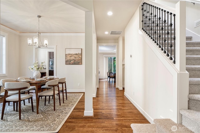 8910 125th Ln NE, Kirkland, WA 98033 - dining space featuring stairs, wood finished floors, a chandelier, recessed lighting, and ornamental molding