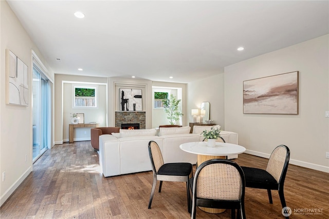 8910 125th Ln NE, Kirkland, WA 98033 - dining area featuring wood finished floors, a fireplace, and recessed lighting