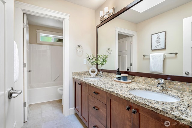 8910 125th Ln NE, Kirkland, WA 98033 - full bath featuring double vanity, tile patterned floors, and tub / shower combination