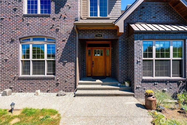 794 W Smith Rd, Bellingham, WA 98226 - property entrance featuring brick siding, a standing seam roof, and metal roof