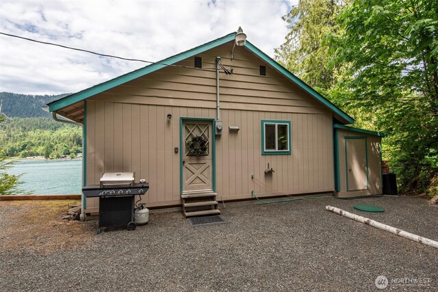 49 Sunny Point Ln, Port Angeles, WA 98363 - back of house featuring entry steps and a water view