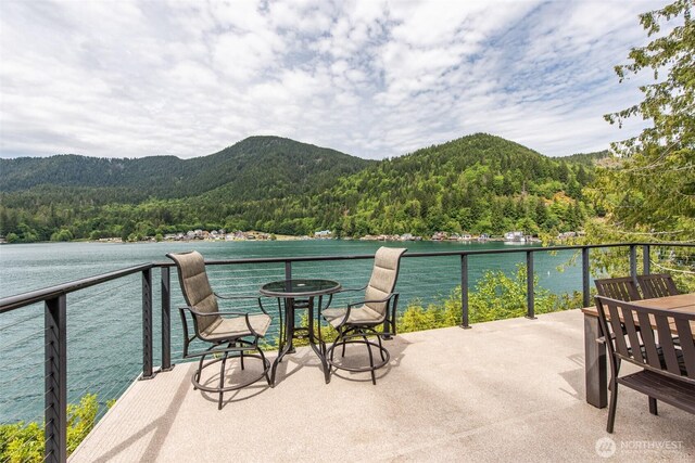 49 Sunny Point Ln, Port Angeles, WA 98363 - balcony featuring a wooded view and a water and mountain view